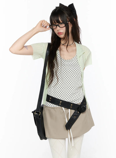 LEWKIN Sheer Pleated Short Sleeve Cardigan CL523 Light green cropped front view on model wearing open over polka dot top with black crossbody bag