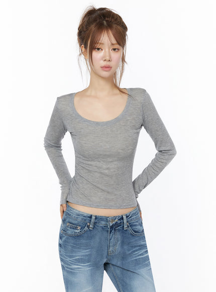 Sheer Slim Fit Long Sleeve Top IU525 Gray front view on model with updo hands behind back scoop neckline slim ribbed knit crop fit paired with jeans
