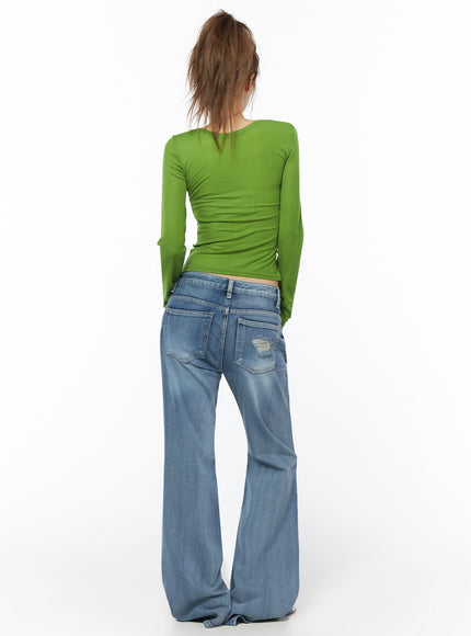 Sheer Slim Fit Long Sleeve Top IU525 Green back view on model showing smooth ribbed knit back seam detail slim fit crop hem above waist with low-rise jeans