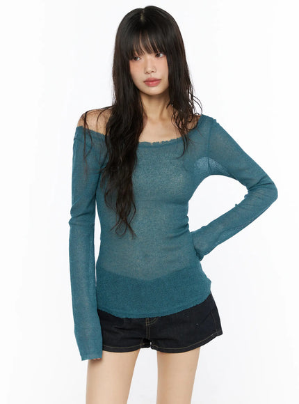 Sheer Slim U-Neck Top CU530 Teal front shot model standing hand on hip off-shoulder sheer slim knit top with frayed neckline and long sleeves over black denim shorts