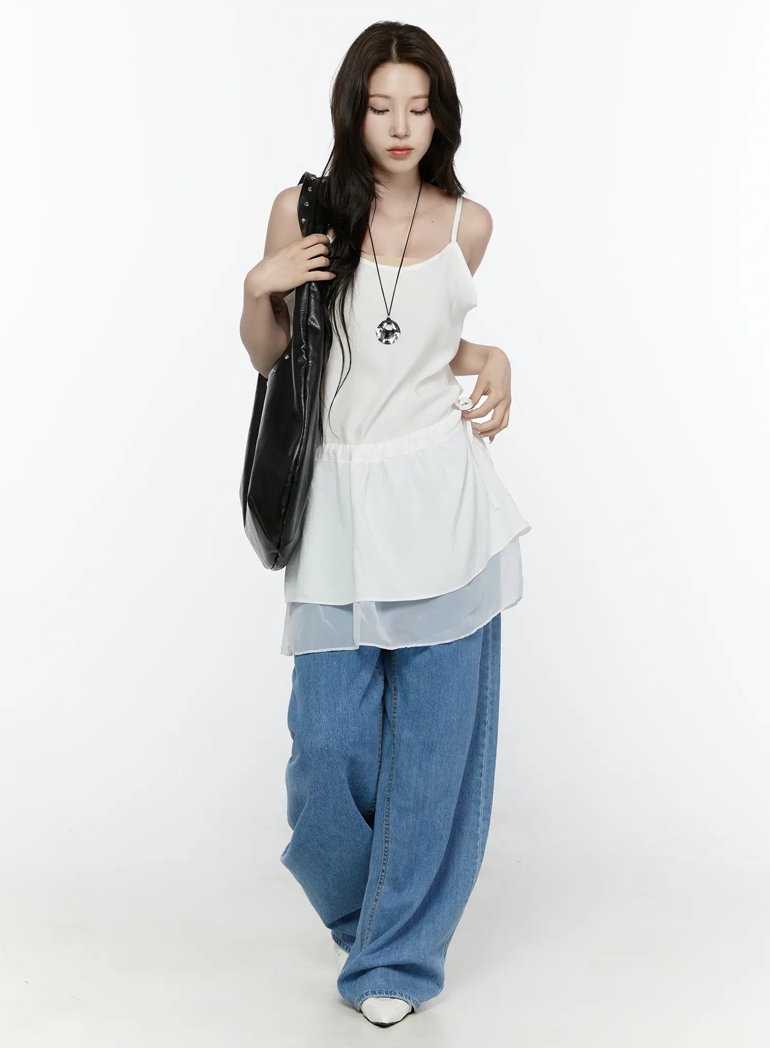 Sheer Strap Layered Dress IL521 White full-length front view on model looking down, carrying studded black tote, with pendant necklace, peplum silhouette, wide-leg jeans