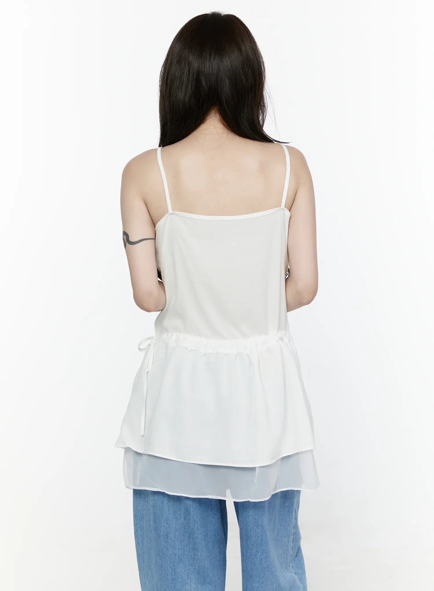 Sheer Strap Layered Dress IL521 White back view on model revealing spaghetti straps, open back, gathered peplum, drawstring waist bow, and sheer organza underlayer