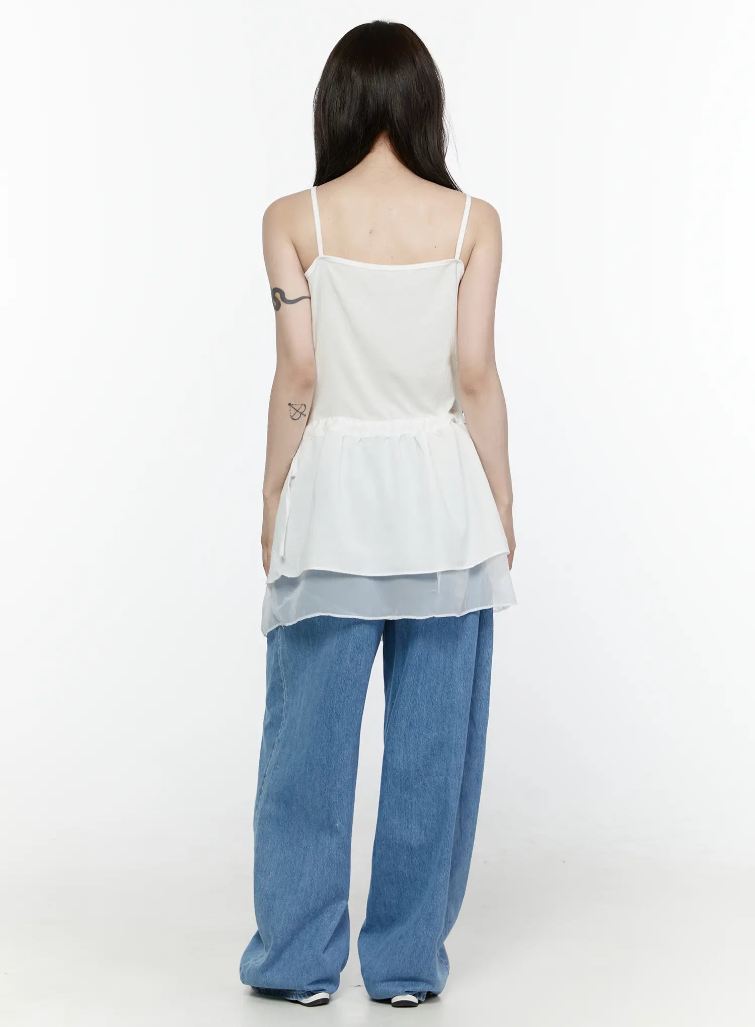 Sheer Strap Layered Dress IL521 White full-length back view on model showing thin straps, gathered peplum, double sheer hem layer, styled with wide-leg blue jeans and white shoes
