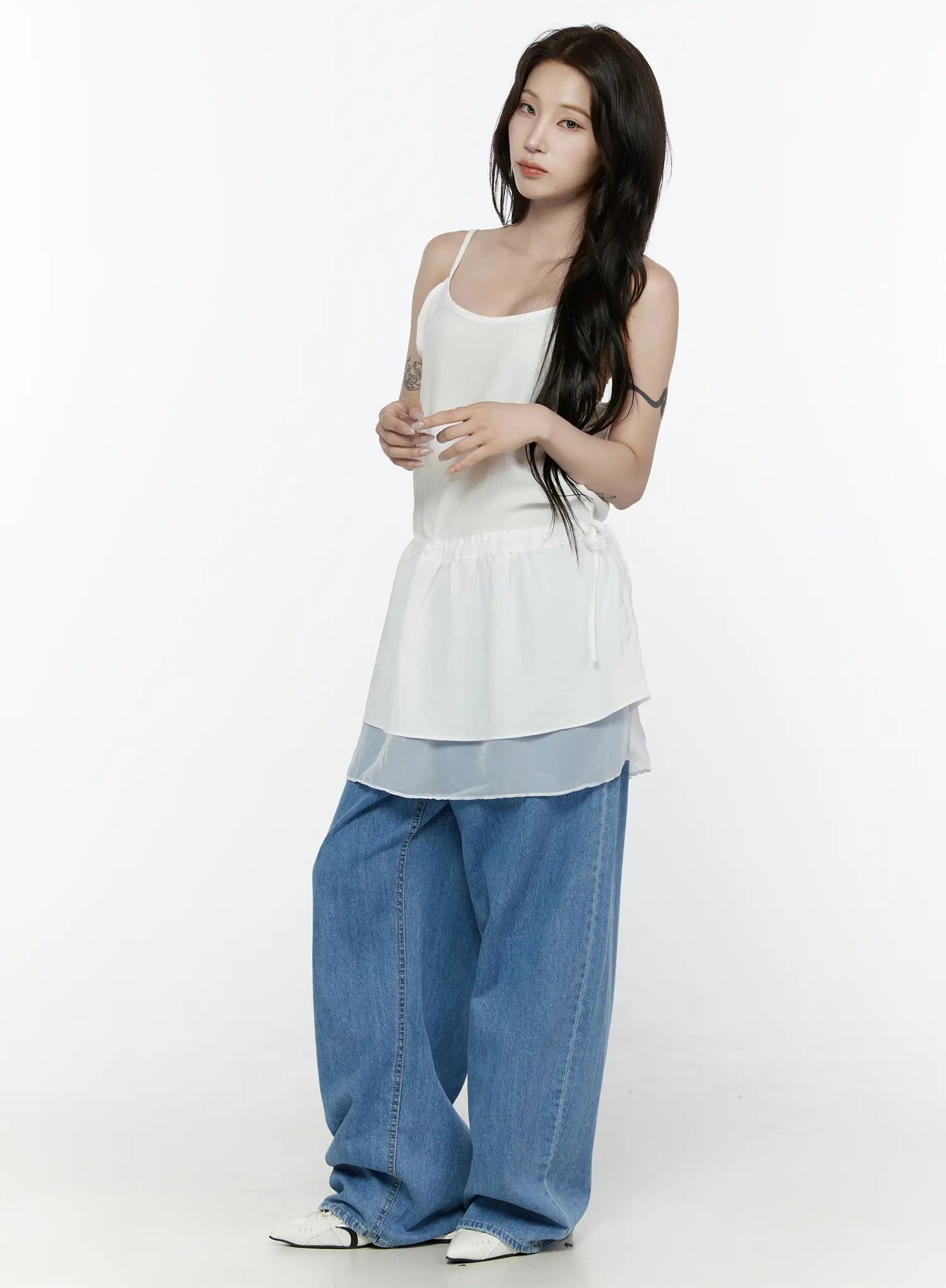 Sheer Strap Layered Dress IL521 White full-length front view on model with arms crossed, scoop neckline, elasticated peplum waist, sheer organza hem, styled with wide-leg jeans