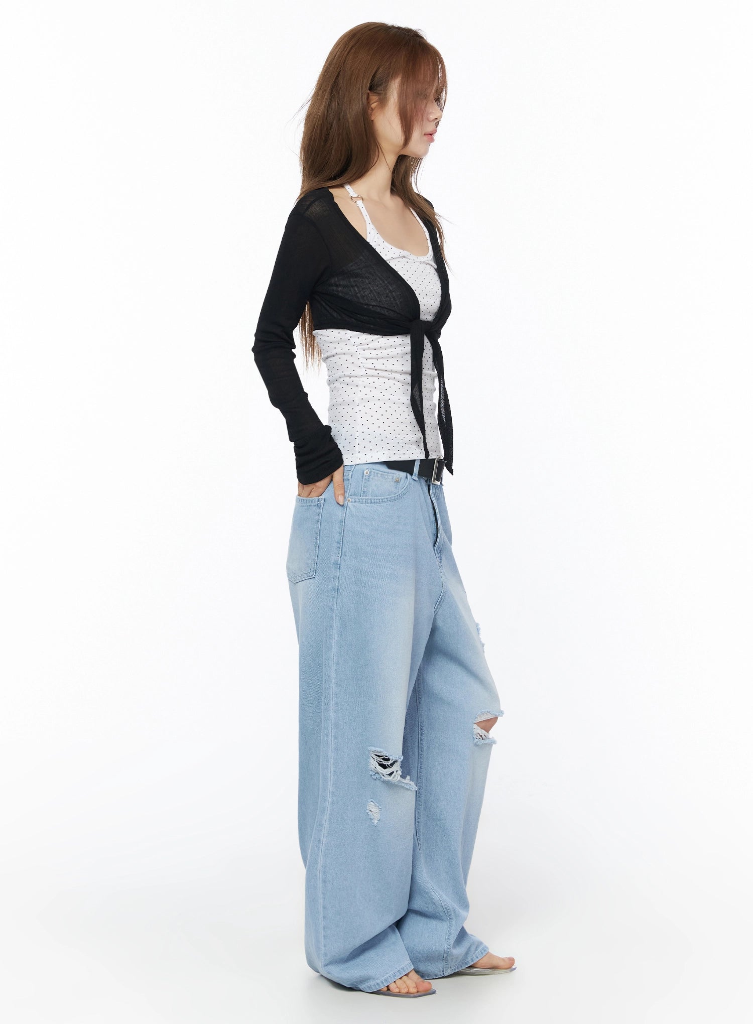 Sheer Tie-Front Wrap Crop Cardigan IL502 Black side model shot showing sheer knit texture cropped silhouette tie detail and wide-leg distressed denim styling