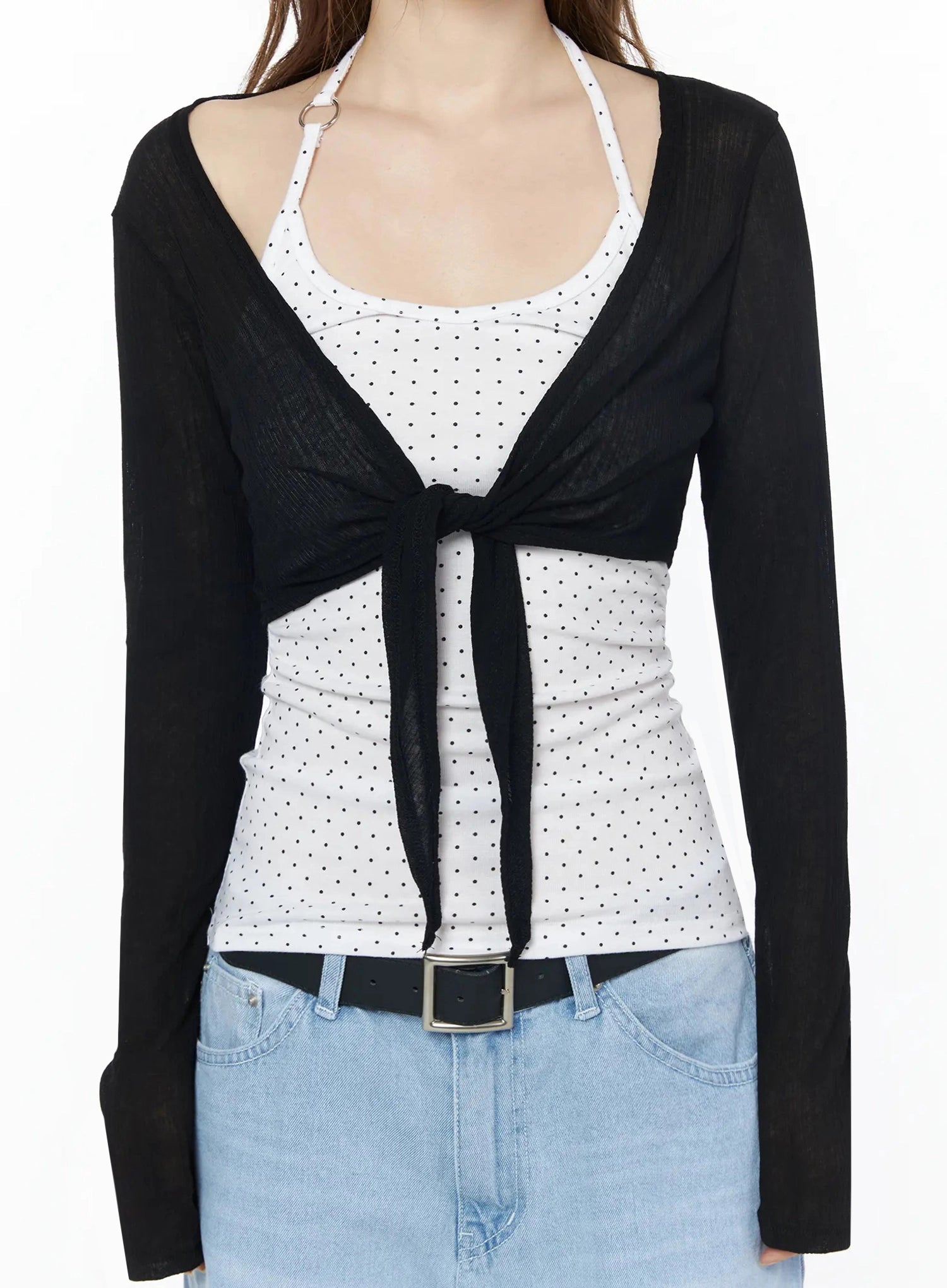 Sheer Tie-Front Wrap Crop Cardigan IL502 Black close-up front torso detail shot showing tie-front knot sheer fabric texture open neckline and polka dot inner tank
