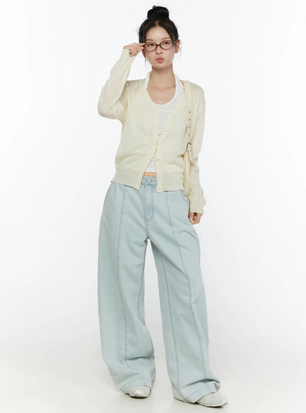 Sheer V-Neck Cardigan CL521 Light beige full-body front shot on model standing upright with glasses and shoulder bag over floral tank and light wash wide-leg jeans