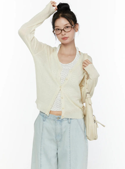 LEWKIN Sheer V-Neck Cardigan CL521 Light beige front shot on model size S/M with bun updo glasses bag styled over floral tank and wide-leg jeans