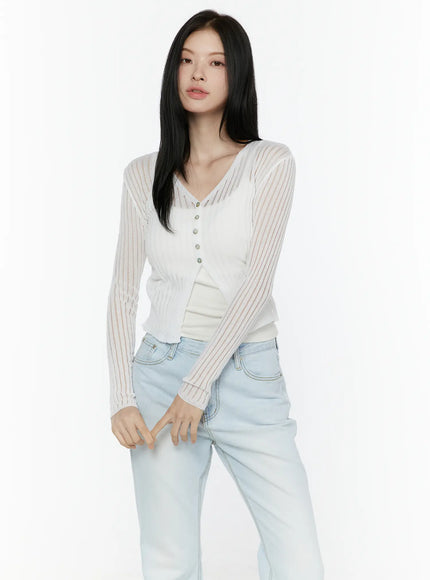 Sheer V-Neck Cardigan IL506 White front shot model standing wearing buttoned sheer ribbed knit cardigan over inner top paired with light blue jeans