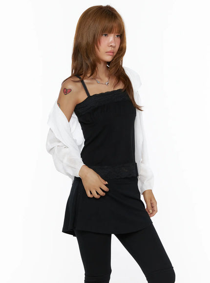Sheered Hooded Cardigan CL503 White side shot on model worn open off shoulder, sheer knit draped loosely, styled with black cami dress and leggings