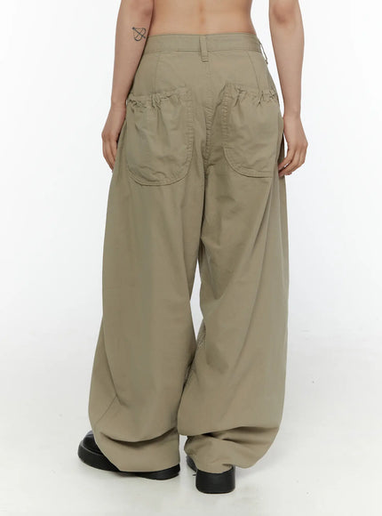 Shirred Balloon Cotton Trousers CL507 Dark green back full-body styling shot on female model with gray ruffle top, brown shoulder bag, and black loafers
