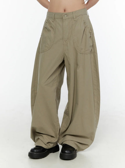 Shirred Balloon Cotton Trousers CL507 Dark green front view on model with khaki tone, wide balloon legs pooling over black chunky loafers, patch pocket detail