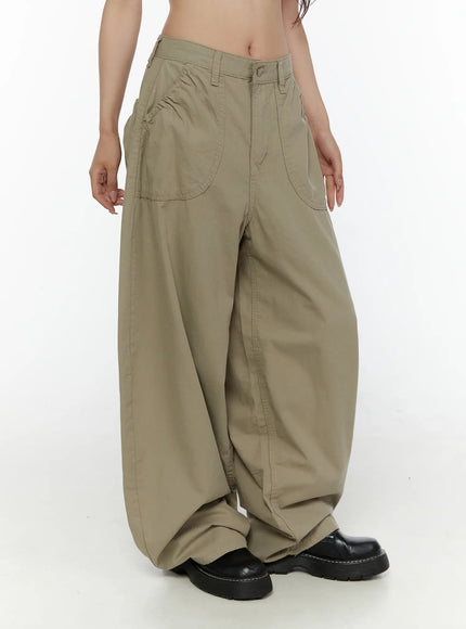 Shirred Balloon Cotton Trousers CL507 Dark green side view on model showing voluminous balloon leg silhouette, patch pockets, and black platform shoes