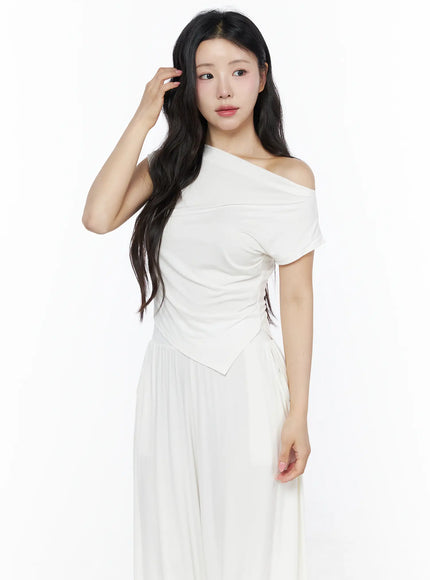 Shirred Boat Neck Tee and Sweatpants Set IU525 White three-quarter front shot on model hand in hair, ruched off-shoulder top with asymmetric hem and wide-leg pants
