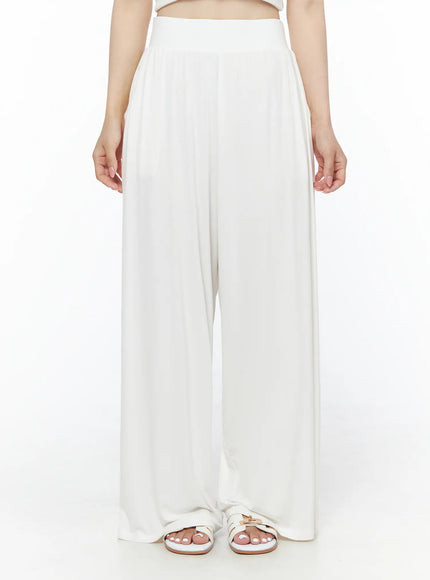 Shirred Boat Neck Tee and Sweatpants Set IU525 White front detail shot on model from waist down, wide-leg high-waist sweatpants with pleated drape and strappy sandals