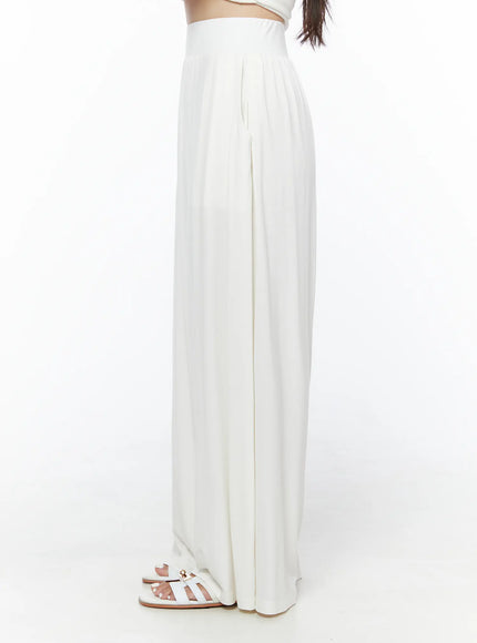 Shirred Boat Neck Tee and Sweatpants Set IU525 White side close-up on model showing high-rise elastic waistband and pleated wide-leg silhouette with sandals