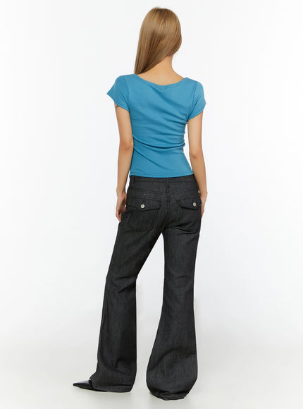 Shirred Cap Sleeve Top IL524 Blue back shot on model showing scoop back neckline cap sleeves and ruched body hem over dark flare jeans