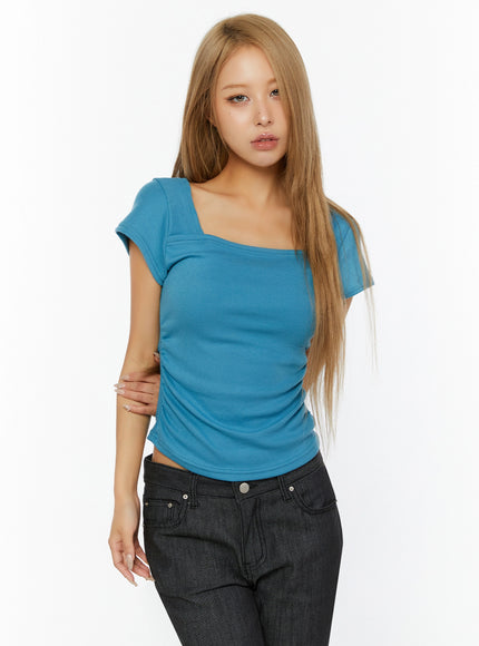 Shirred Cap Sleeve Top IL524 Blue three-quarter front shot on model hand on hip showing fitted silhouette ruching and square neckline
