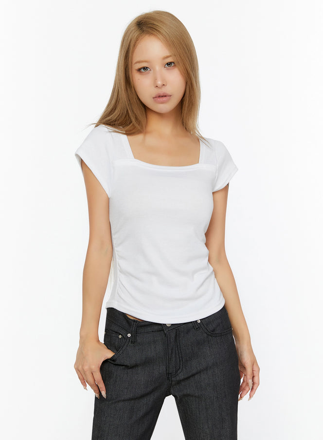 Shirred Cap Sleeve Top IL524 White front shot on model with square neckline cap sleeves fitted ribbed knit tucked into dark denim