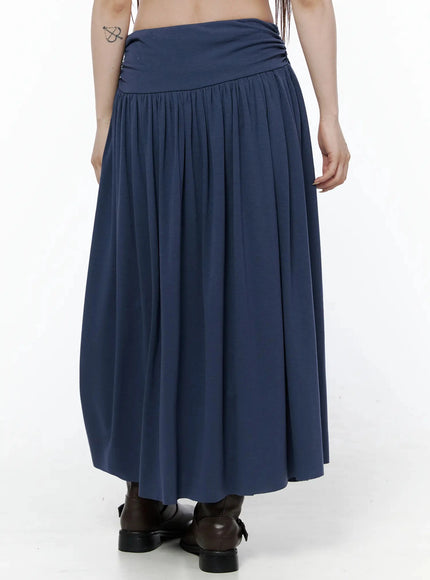 Shirred Flare Maxi Skirt IL502 Dark blue back waist-down shot on model showing ruched waistband back detail and full flared pleated skirt with buckle boots