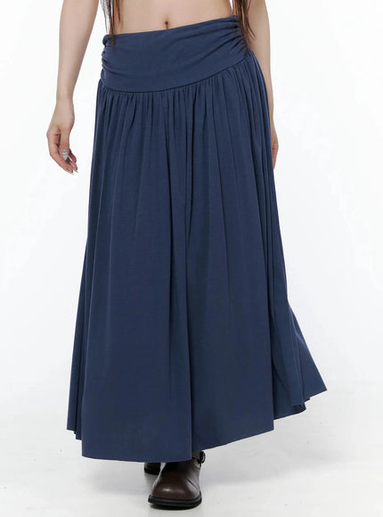 Shirred Flare Maxi Skirt IL502 Dark blue front waist-down shot on model showing wide fold-over ruched waistband and flared gathered skirt with brown boots