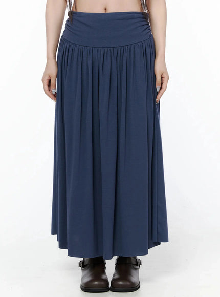 LEWKIN Shirred Flare Maxi Skirt IL502 Dark blue front close-up on model, wide ruched waistband and gathered pleats, paired with brown buckle boots, size S/M