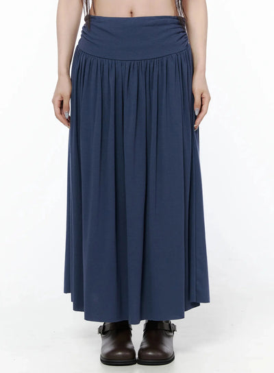 LEWKIN Shirred Flare Maxi Skirt IL502 Dark blue front close-up on model, wide ruched waistband and gathered pleats, paired with brown buckle boots, size S/M