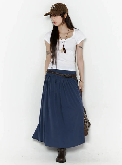 Shirred Flare Maxi Skirt IL502 Dark blue full-body front styled shot on model with leopard cap, white tee, braided belt, pendant necklace, and brown handbag