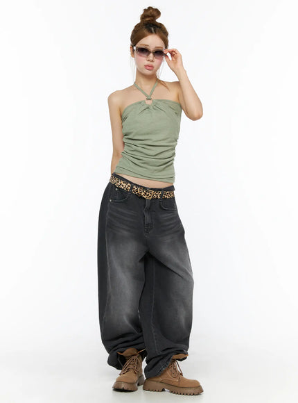 Shirred Halter Top CL501 Dark green full-body front on standing model wearing sunglasses, O-ring halter neckline, ruched body, leopard belt and grey baggy jeans
