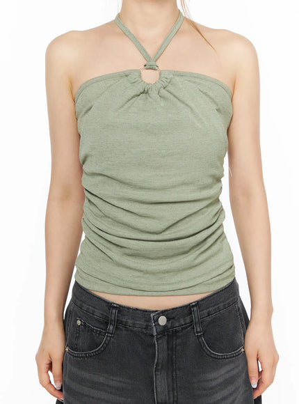 Shirred Halter Top CL501 Dark green close-up front torso shot on model highlighting O-ring halter strap, gathered chest ruching, and ribbed knit texture