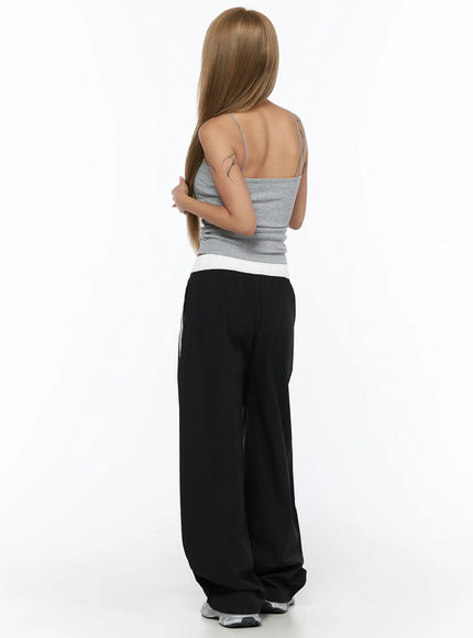 Shirred Padded Tank Top CU523 Gray back model shot full-length showing open back spaghetti strap detail with black stripe track pants