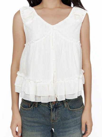 Shirred Ribbon Sleeveless Blouse CL510 White close-up detail front shot on model cropped at waist highlighting ruffle trim, button front and textured stripe fabric