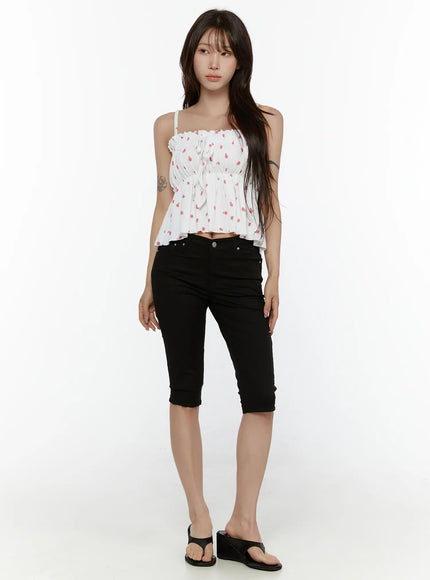 Shirred Ribbon Sleeveless Top CL507 White full-body front shot on model styled with black cropped capri pants and wedge sandals, showing flared peplum silhouette