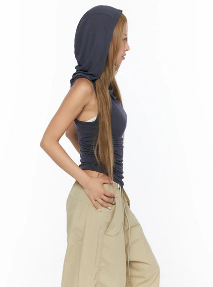 Shirred Sleeveless Hooded Crop Top CU524 Dark gray side view on model with large hood up hand on hip showing ruched waist and fitted silhouette