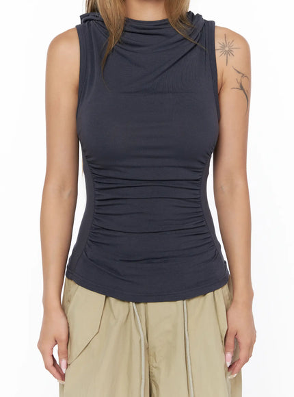 Shirred Sleeveless Hooded Crop Top CU524 Dark gray close-up detail shot of side ruching and curved hem seam on model showing stretch jersey texture