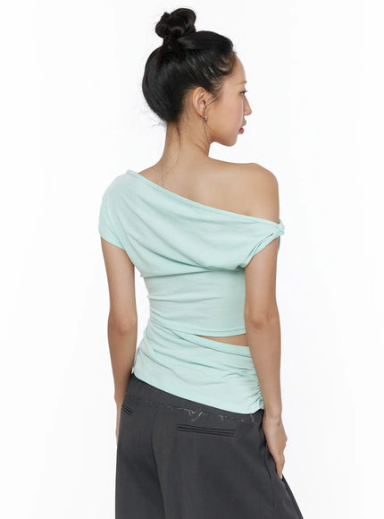 Shirred Slit Off-Shoulder Tee CL510 Mint back model rear view twist knot shoulder draped back neckline ruched back panel cutout waist styled with grey trousers