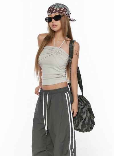 Shirred Strap Tube Top CU523 Light beige S/M front model shot styled with dark track pants bandana and camo bag ruched halter crop top