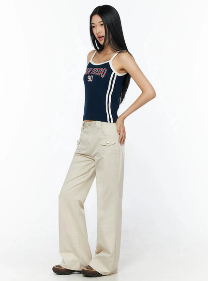 Side Stripe Contrast Trim Cami Top IL516 Dark blue three-quarter side model shot showing white double side stripe detail and SAN DIEGO 90 graphic on ribbed fabric