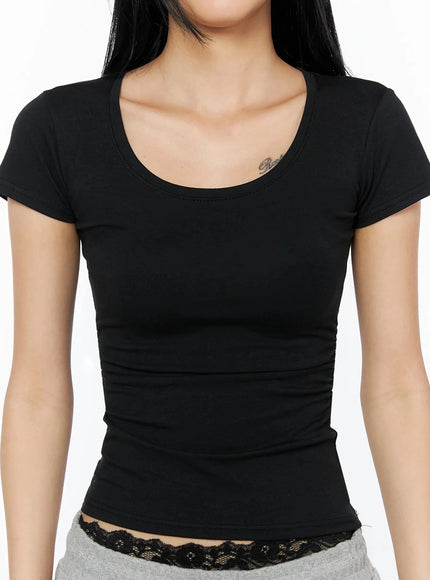 Silky Shirred Short Sleeve Tee IL509 Black close-up front shot scoop neckline short sleeves smooth stretch fabric fitted bodice visible ruching at waist lace waistband peek