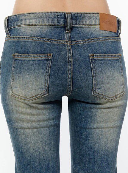 Simi Vintage Washed Capri Jeans IU524 Dark blue close-up back detail of dual pockets, ozbridge leather patch, amber contrast stitching, and vintage wash texture