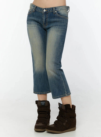 Simi Vintage Washed Capri Jeans IU524 Dark blue side shot on model showing left-side silhouette, low-rise fit, cropped flare leg opening, and wedge sneakers