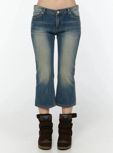 LEWKIN Simi Vintage Washed Capri Jeans IU524 Dark blue front view on model showing low-rise waist, faded wash denim, cropped flare hem, styled with wedge sneakers