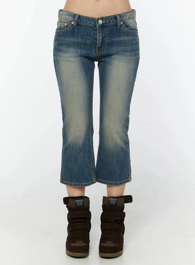 LEWKIN Simi Vintage Washed Capri Jeans IU524 Dark blue front view on model showing low-rise waist, faded wash denim, cropped flare hem, styled with wedge sneakers