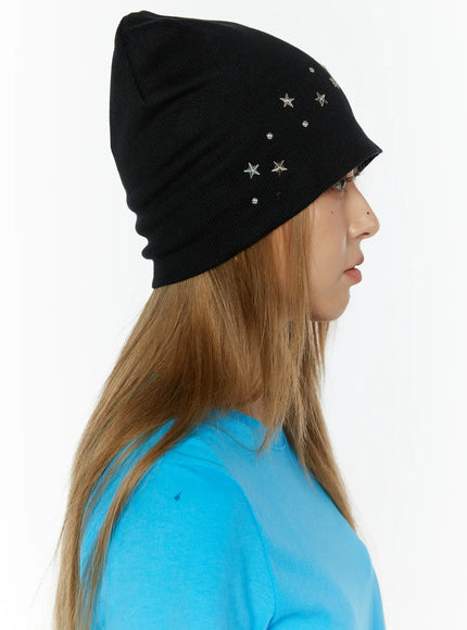 Simic Starmix Beanie IL503 Black side view on model with long hair, showing silver star stud placement across knit slouchy silhouette