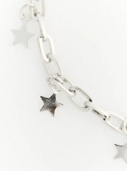 Skye Star Cut Bracelet IL522 silver close-up detail of oval link chain section with two dangling star charms showing polished and brushed finishes