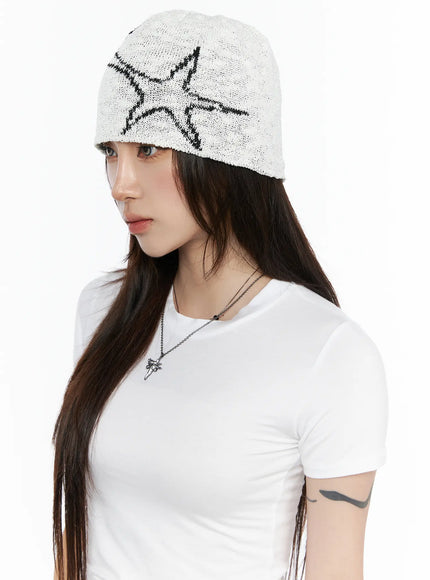 LEWKIN Slab Star Beanie IL503 White front view on model wearing white T-shirt, open-knit texture with black star graphic pattern