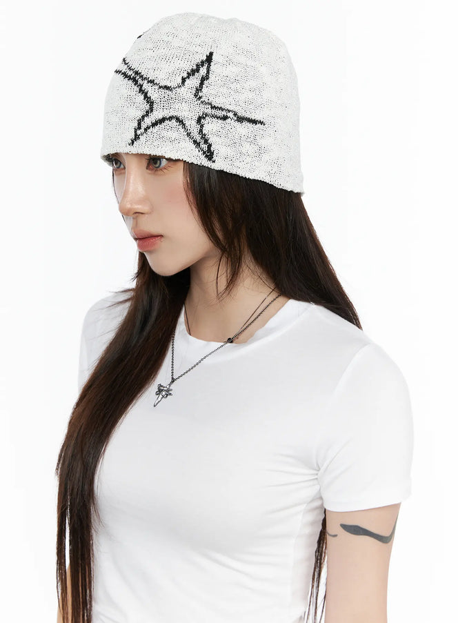 LEWKIN Slab Star Beanie IL503 White front view on model wearing white T-shirt, open-knit texture with black star graphic pattern