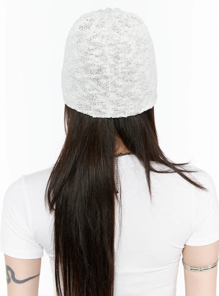 Slab Star Beanie IL503 White back view on model, plain open-knit white cap showing clean finish and fit, worn with white T-shirt