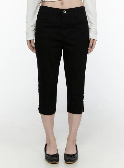 LEWKIN Slim Capri Pants IL521 Black Size S front view on model wearing white crop top and black ballet flats, cropped denim with button closure and hem slits