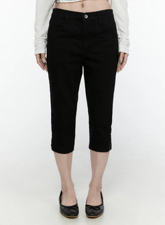 LEWKIN Slim Capri Pants IL521 Black Size S front view on model wearing white crop top and black ballet flats, cropped denim with button closure and hem slits
